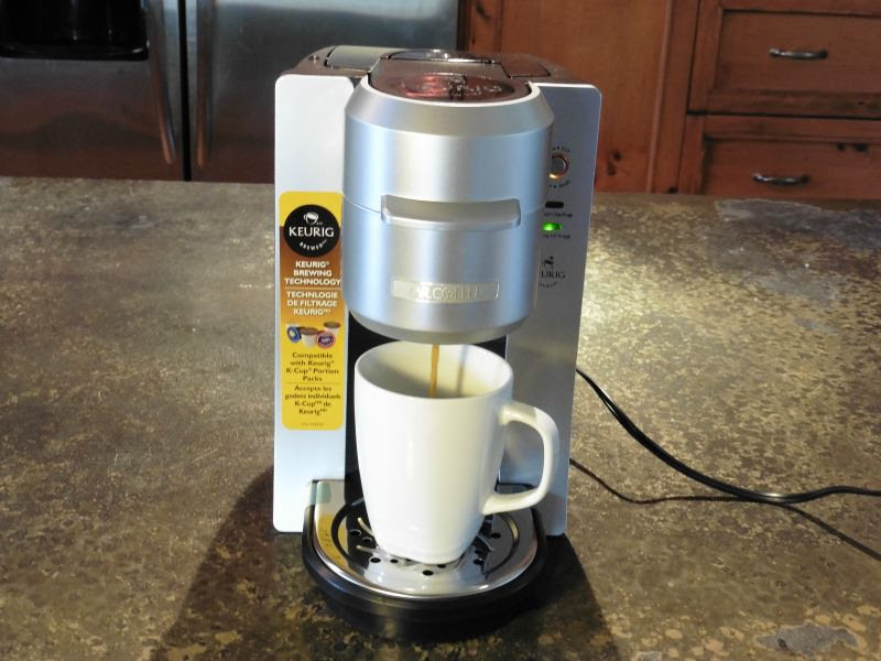 Brewing a cup of coffee Mr. Coffee Single Serve Coffee Maker