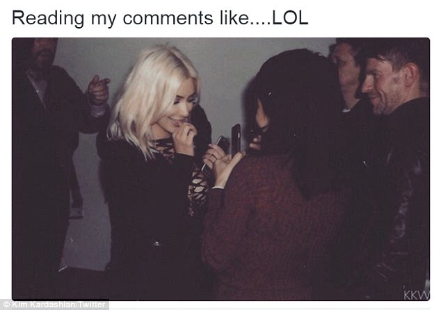 Whatever: Kim did not seem to be too concerned posting another picture of herself in 2015 looking at her phone saying 'Reading my comments like LOL'