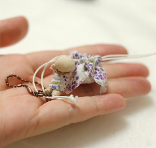 Tiny sarubobo and drawstring bag