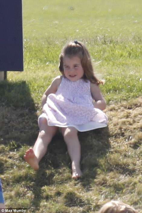 Charlotte was clearly enjoying spending time in the great outdoors as she slid down a grassy verge