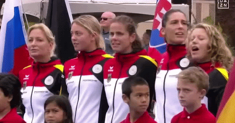 The women's team looked visibly tense and upset as the soloist belted out the lines "Germany, Germany, above all, above all in the world" before a Fed Cup match in Hawaii.