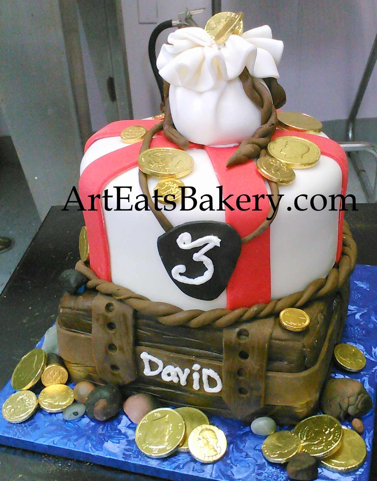 Boy's Pirate treasure chest creative birthday cake with edible money bag and chocolate gold coins.jpg