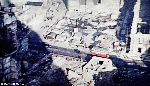 These images, above and below, show terrible bomb damage in the shadow of St Pauls Cathedral in the heart of the City of London