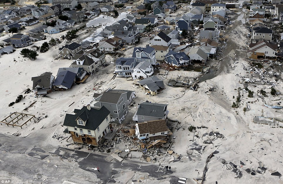 Bearing the brunt: The President took the helicopter tour to see for himself how homes in Seaside Heights, New Jersey, were destroyed in the storm