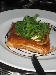 Baked Puff Pastry Tart w/ leeks a la grecque, slow roasted tomatoes & crottin goats cheese  £5.50