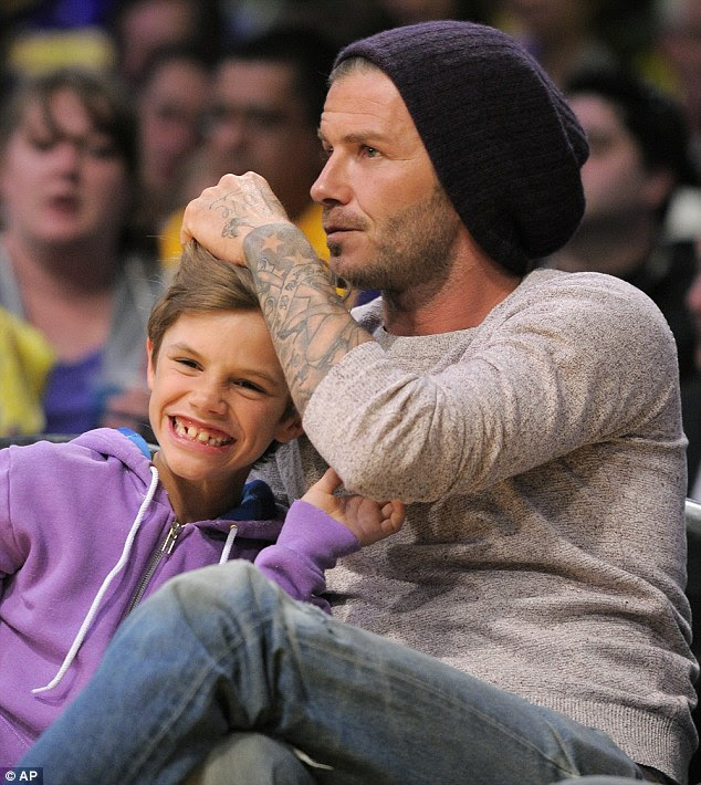 Just the two of us: David Beckham spent time with his nine-year-old son Romeo last night at the LA Lakers vs. Oklahoma City Thunder basketball match