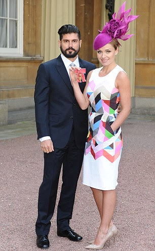 Star turn: The singer receiving her OBE at Buckingham Palace last month with boyfriend Andrew Levitas and, right, another of the campaign posters