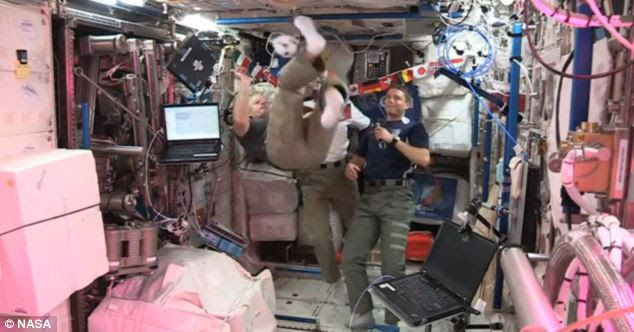 The weightless movement of the astronauts is because they are in a continuous state of freefall. Pictured here astronauts onboard the ISS have their own kickabout ahead of the World Cup