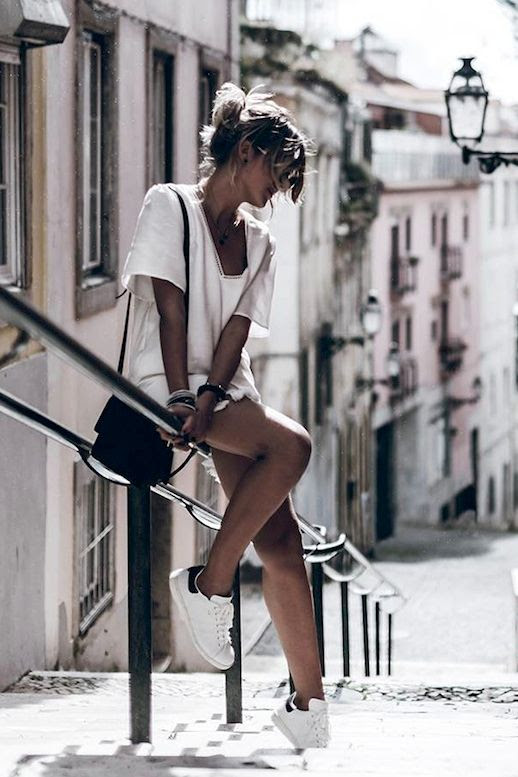 Le Fashion Blog Blogger Style Vacation Look Messy Bun Anine Bing White Dress With Tassels Bracelets Small Leather Bag White Sneakers Via @Mikutas