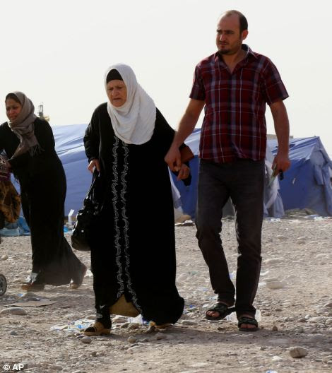 Iraqi refugees from Mosul arrive at Khazir refugee camp outside Irbil, 217 miles (350 kilometres) north of Baghdad, Iraq