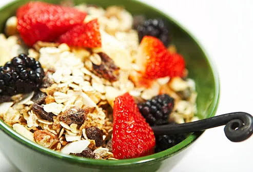 bowl of whole grain cereal with fresh berries