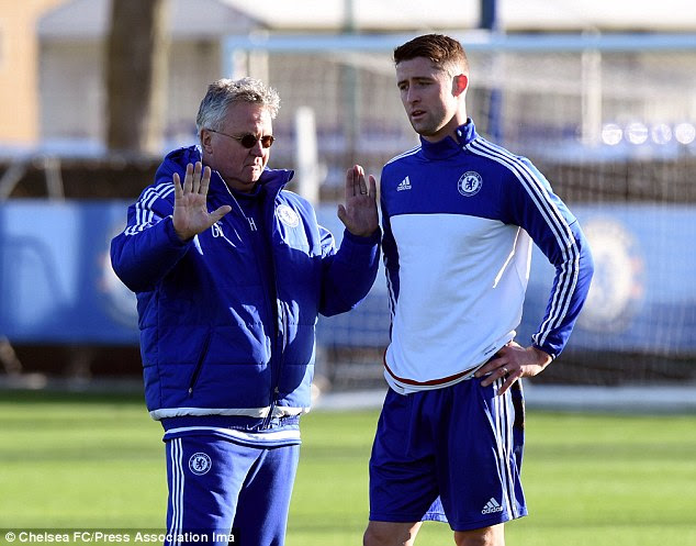Guus Hiddink (left) issues instructions to Cahill as he implements his methods on struggling Chelsea squad