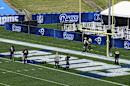 Crew members paint the endzone with the Rams lettering at the Los Angeles Memorial Coliseum in Los Angeles on Friday, Aug. 12, 2016. The Los Angeles Rams are about to make their return to Los Angeles a reality in what might be called their homecoming game. Technically, Saturday's game with the Dallas Cowboys is just a preseason opener at a temporary home for a relocating team that hasn't made the playoffs in 11 years. But that temporary home is also the team???s traditional home, the Los Angeles Memorial Coliseum, where they'll play as the host team for the first time in 36 years, giving the day huge symbolic importance for fans. (AP Photo/Richard Vogel)