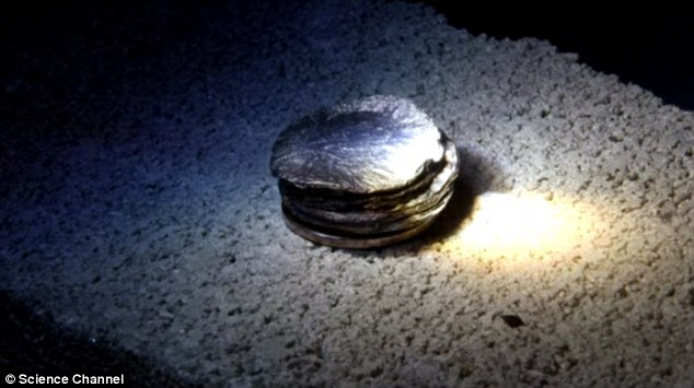 The device has been used to liquefy a pile of zinc disks (pictured), meaning that the beam was hotter than 450°C (842°F).  It was made by Kevin Moore and Grant Reynolds of the Science Channel