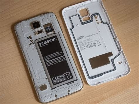 · press and hold the power key · quickly release the power key (when samsung logo appears) . Samsung Galaxy S5 official wireless charging cover hands