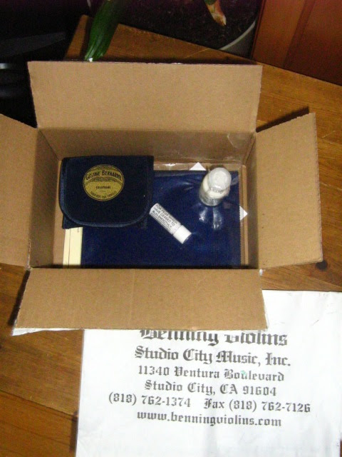 The open box of cello goodies...