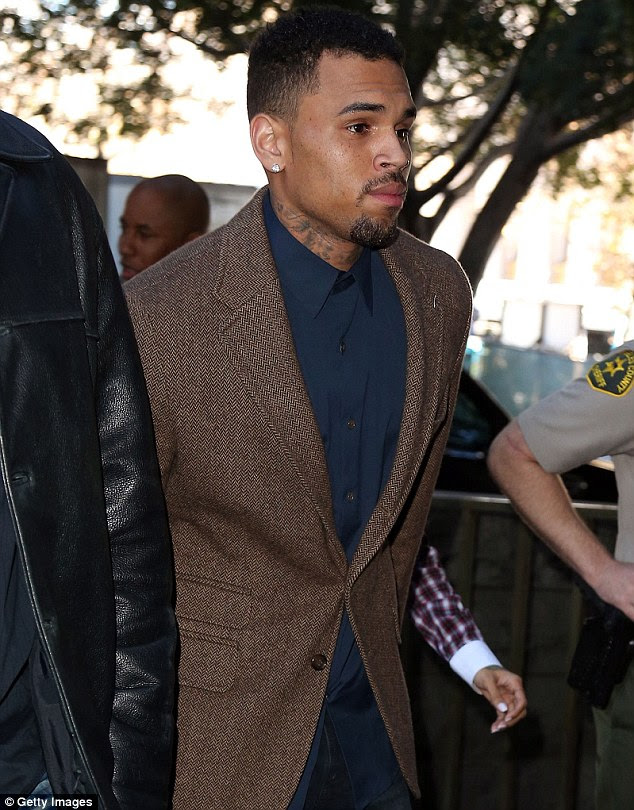 Trouble: Brown arrives at Los Angeles Courthouse on Monday