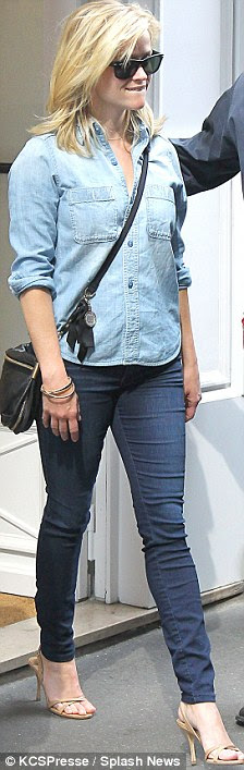 Shopping spree: Reese was shopping in Paris earlier in the day at the Carven store in the French capital