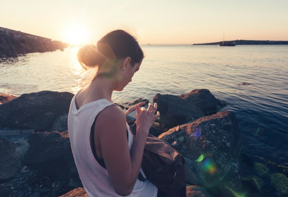 Girl Sitting by Ocean