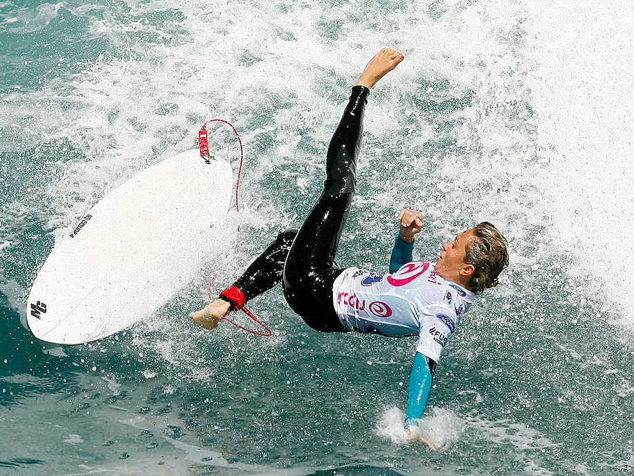 surfer surfing wipe out wave