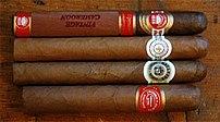 Four cigars of different brands (from top: H.