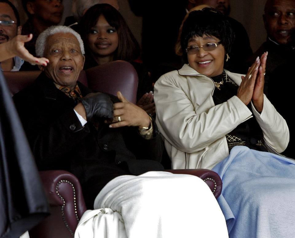 FILE - In this Thursday, Aug. 21, 2008 file photo former president Nelson Mandela, left, and his ex-wife Winnie Madikizela-Mandela, right, during the unveiling of a statue of Mandela at the Drakenstein Prison near Franschhoek, South Africa. Madikizela-Mandela told a South African newspaper published Sunday Nov. 17, 2013, that Mandela, remains "quite ill" and unable to speak because of tubes that are keeping his lungs clear of fluid, though he is relaxed. (AP Photo/Schalk van Zuydam-File)