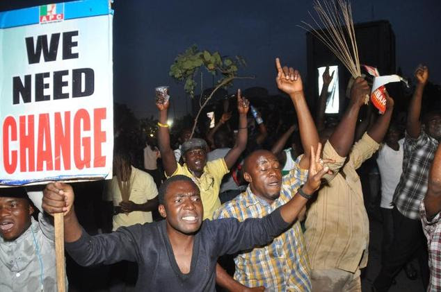 People celebrate on March 31, 2015 the victory of main opposition All Progressives Congress (APC) presidential candidate Mohammadu Buhari in Abuja, Nigeria