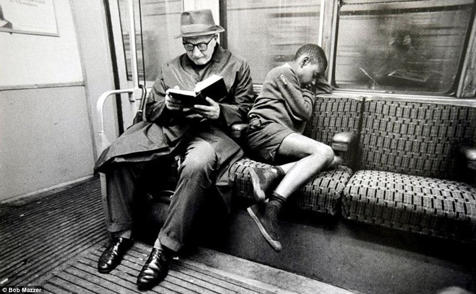 A young boy catches 40 winks while an elderly gent reads. Mazzer got his first camera, an Ilford Sporty, at 13 as a Bar Mitzvah present