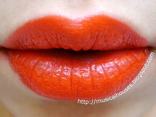 sleek tangerine scream lipstick