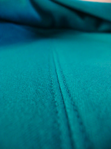 twin needle stitching down the back of the cowl