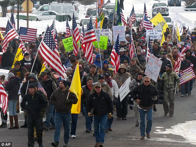 Protesters march on Court Avenue in support of an Oregon ranching family facing jail time for arson in Burns, Oregon, on Saturday. Soon after, they occupied Malheur National Wildlife refuge building in Princeton, Oregon