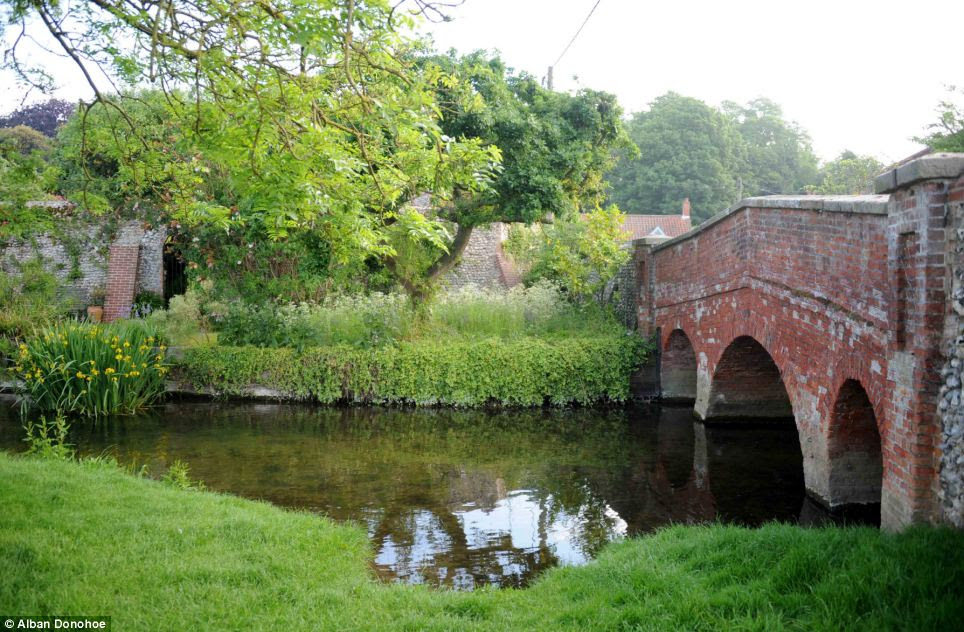 Mirror image: In an almost identical shot, Stiffkey River, which travels from its source near Swanton Novers to the North Sea, reflects sun rays today