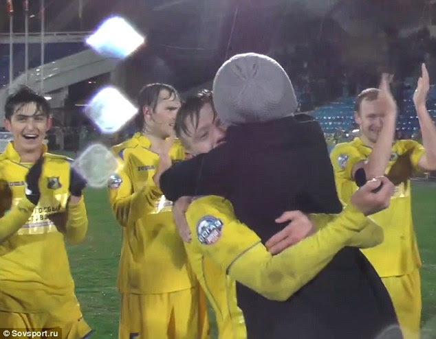 Novoseltsev's team-mates applaud as the happy couple share a moment to remember on the pitch