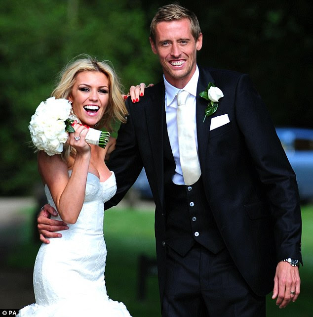 Ready to party: The couple can't stop smiling following their ceremony at the Church of St Mary Magdalene