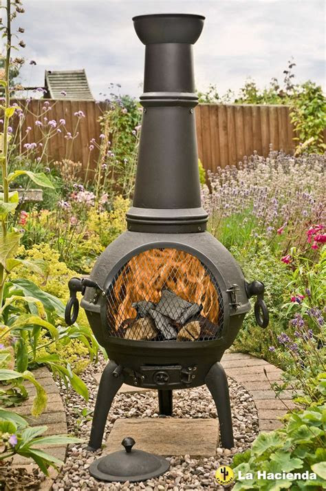 Learn tips for selecting a fire pit dining table. La Hacienda Black Lisbon 125cm Cast Iron Chiminea Chimenea