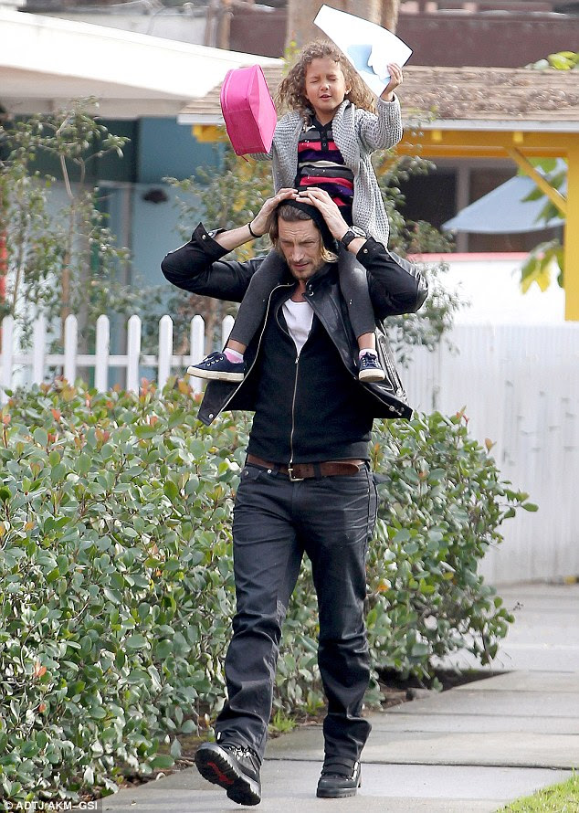 Shouldering the burden: Gabriel Aubry let daughter Nahla see a whole new perspective when he picked her up from school on Wednesday