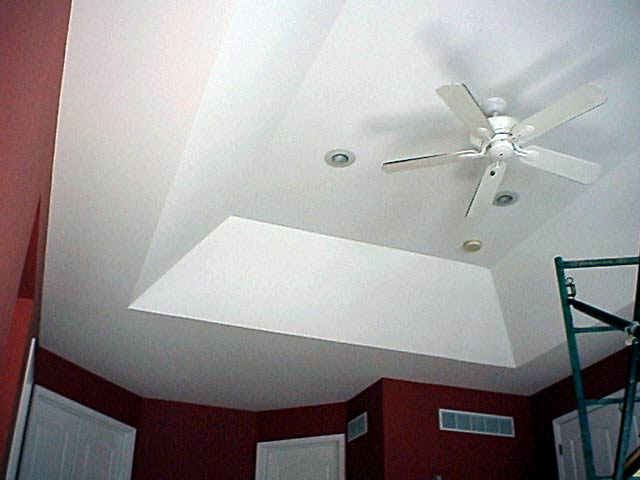 This "before" photo shows an area in the lower part of the ceiling over an 