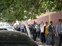 Waiting in a queue in the street
