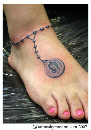 Hot looking Leo Foot Tattoo Source:
