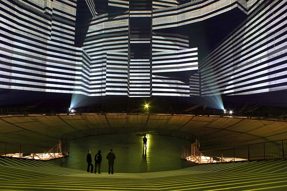 320° Licht: A Repurposed 112 Meter High Gas Tank Converted into a Cathedral of Light projection light installation 
