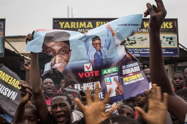 Nigerians celebrate in the flashpoint northern city of Kaduna on March 31, 2015 the victory of main opposition All Progressives Congress (APC) presidential c...