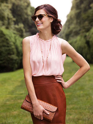 Model in pink shirt and brown skirt