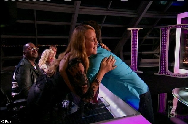 Star support: Mariah offered him a hug as he left the sound stage