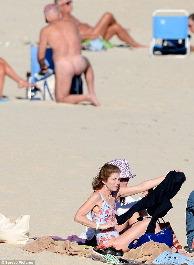 Looking the other way: Kennedy opted to focus her attention on her family as opposed to the nude beachgoers