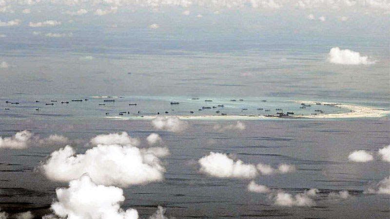 COURT RULING COUNTDOWN  This photo, taken on May 11, 2015, shows land reclamation on Panganiban Reef in the Spratly Islands in the South China Sea.  A landmark ruling on Tuesday on the arbitration case brought by the Philippines that seeks to strike down China’s claim to almost all of the South China Sea will be a test for international law and world powers. AP