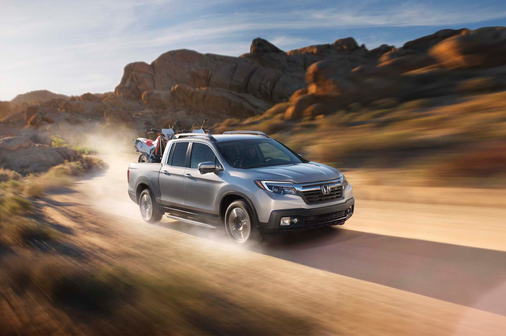 2017 Honda Ridgeline front three quarter in motion 1