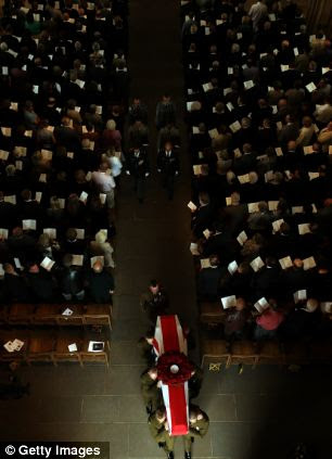 The coffin of World War I veteran Harry Patch leaves Wells Cathedral