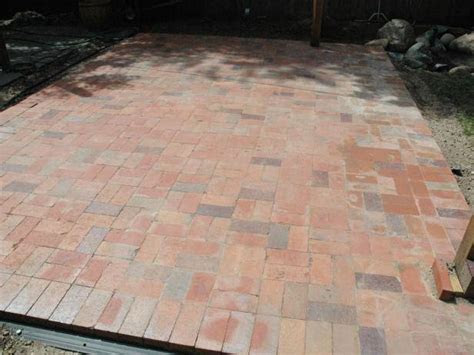Make sure you are wearing gloves or you'll reek of scented oil for a day. How to Lay Your Own Brick Patio Just Right - KnockOffDecor.com