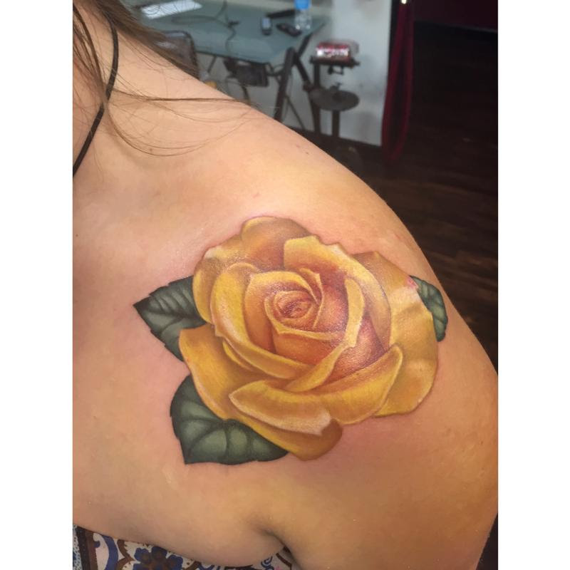 yellow rose tattoo on shoulder