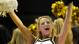 A Vanderbilt Commodores cheerleader celebrates her team scoring against the Alabama Crimson Tide. Alabama won 58-54.